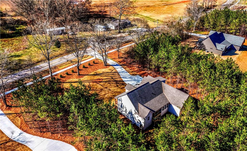 136 Rainey Road Temple, GA 30179 - Photo 74 of 75 an aerial view of a house with a yard and trees