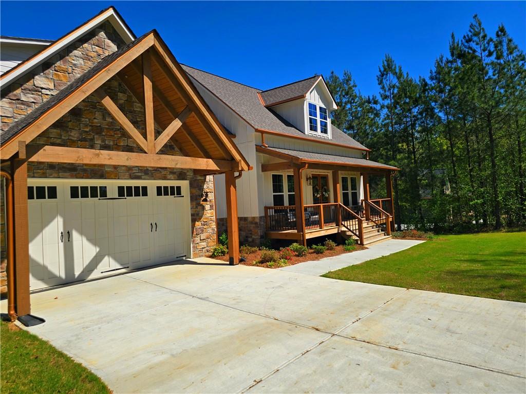 136 Rainey Road Temple, GA 30179 - Photo 8 of 75 a view of house with yard outdoor seating and entertaining space