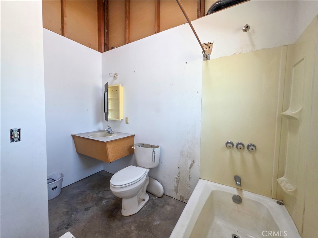 7021 Quarry Road Weed, CA 96094 - Photo 12 of 37 a bathroom with a sink toilet and shower