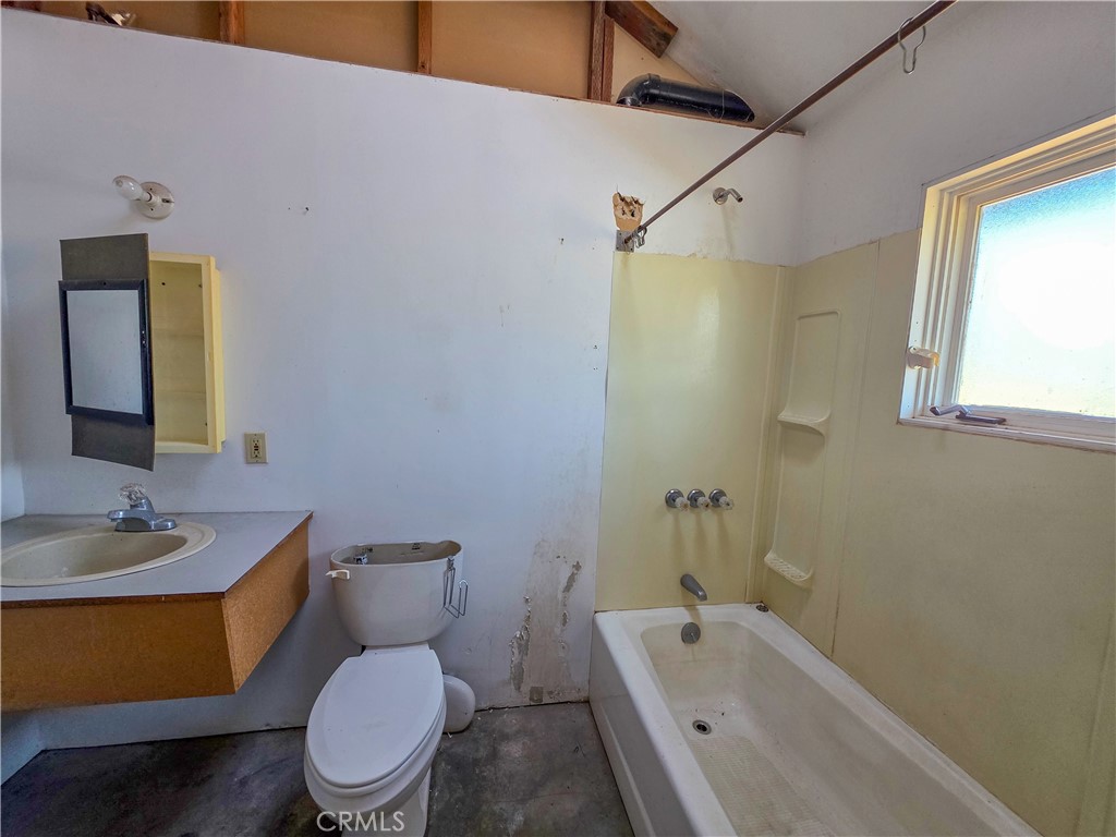 7021 Quarry Road Weed, CA 96094 - Photo 14 of 37 a bathroom with a sink a toilet and shower