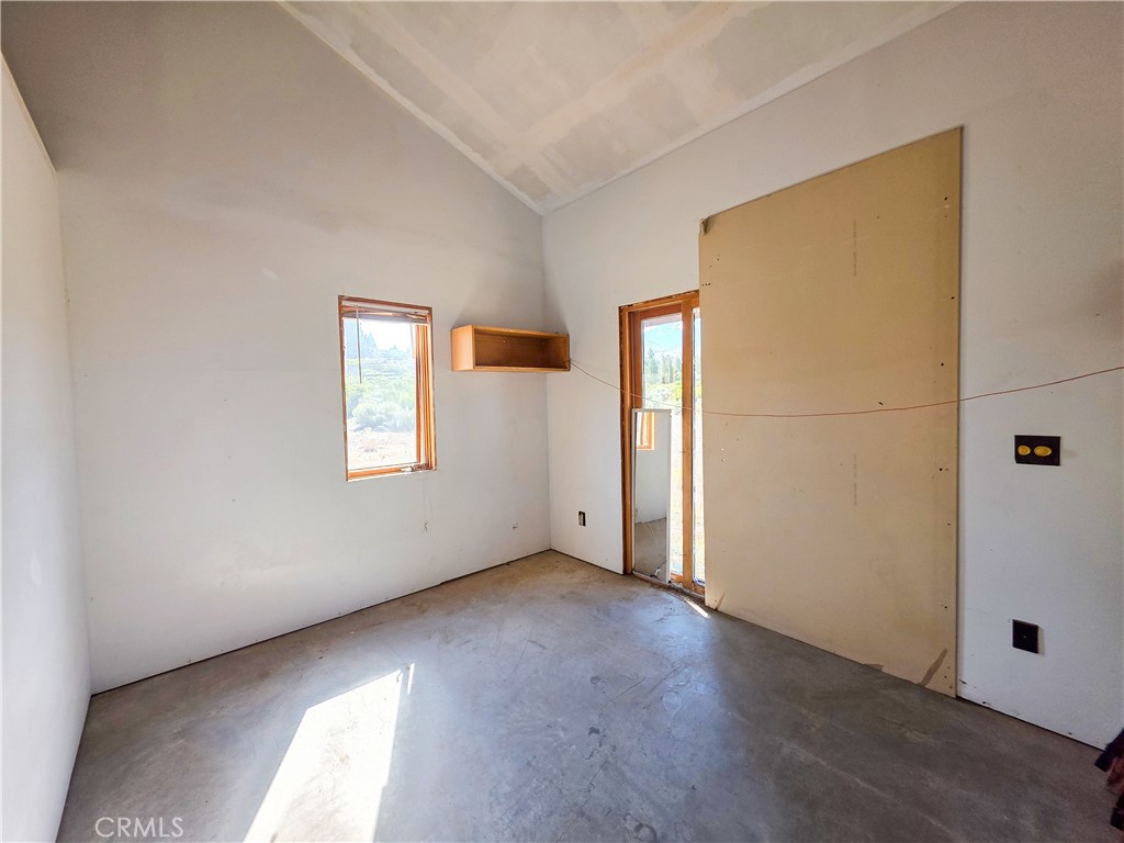 7021 Quarry Road Weed, CA 96094 - Photo 16 of 37 an empty room with windows