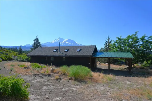 a house view with a lake view