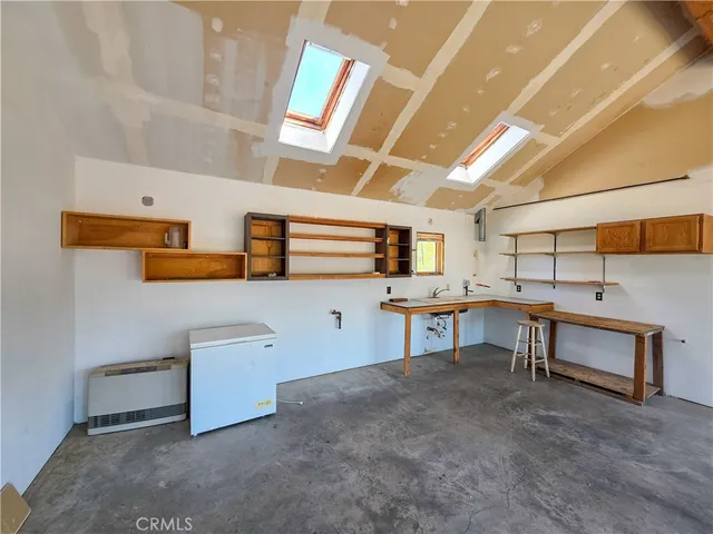 a view of a room with furniture and window