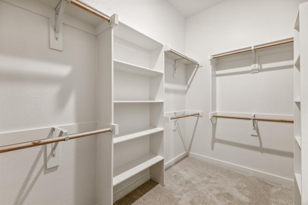 136 Millwood Road Lavon, TX 75166 - Photo 15 of 21 Primary Closet in the Cedar home plan by Trophy Signature Homes – REPRESENTATIVE PHOTO