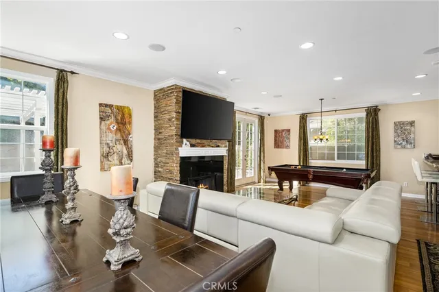 a living room with fireplace furniture and a flat screen tv