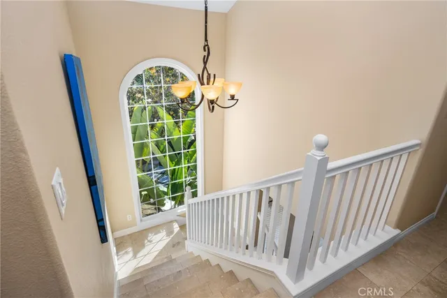 a view of staircase with white walls