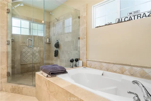 a bathroom with a bathtub and shower