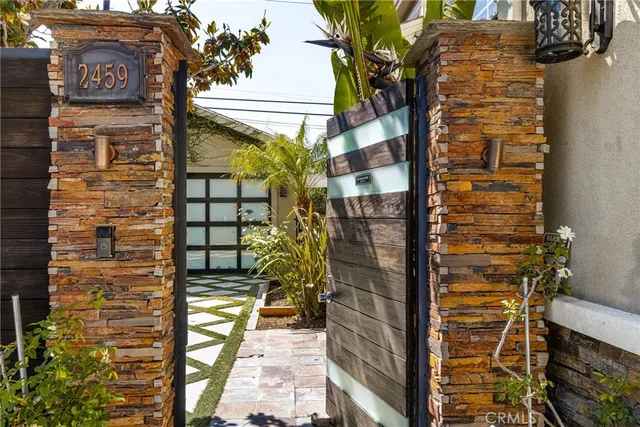 a brick building with a street sign