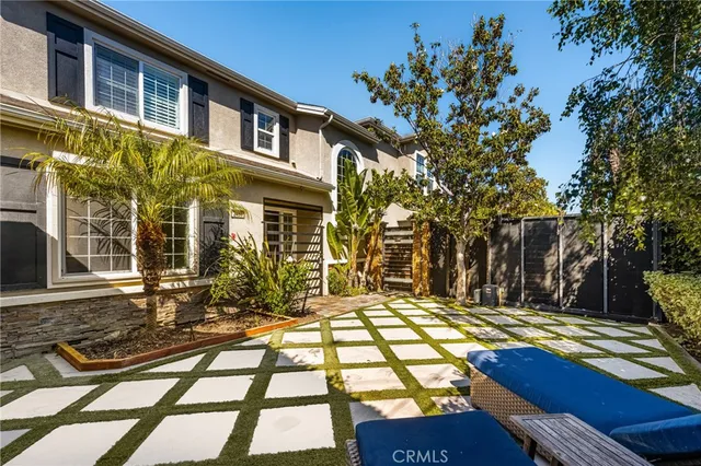 a view of a brick house with many windows