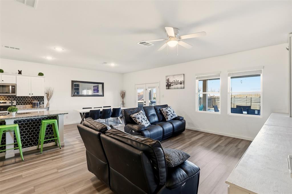 791 Devonshire Drive Lavon, TX 75166 - Photo 11 of 32 a living room with furniture and a wooden floor