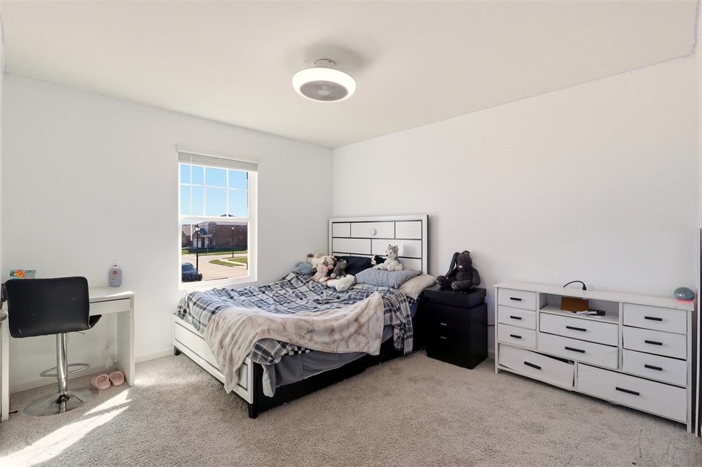 791 Devonshire Drive Lavon, TX 75166 - Photo 21 of 32 a bedroom with a bed and a closet