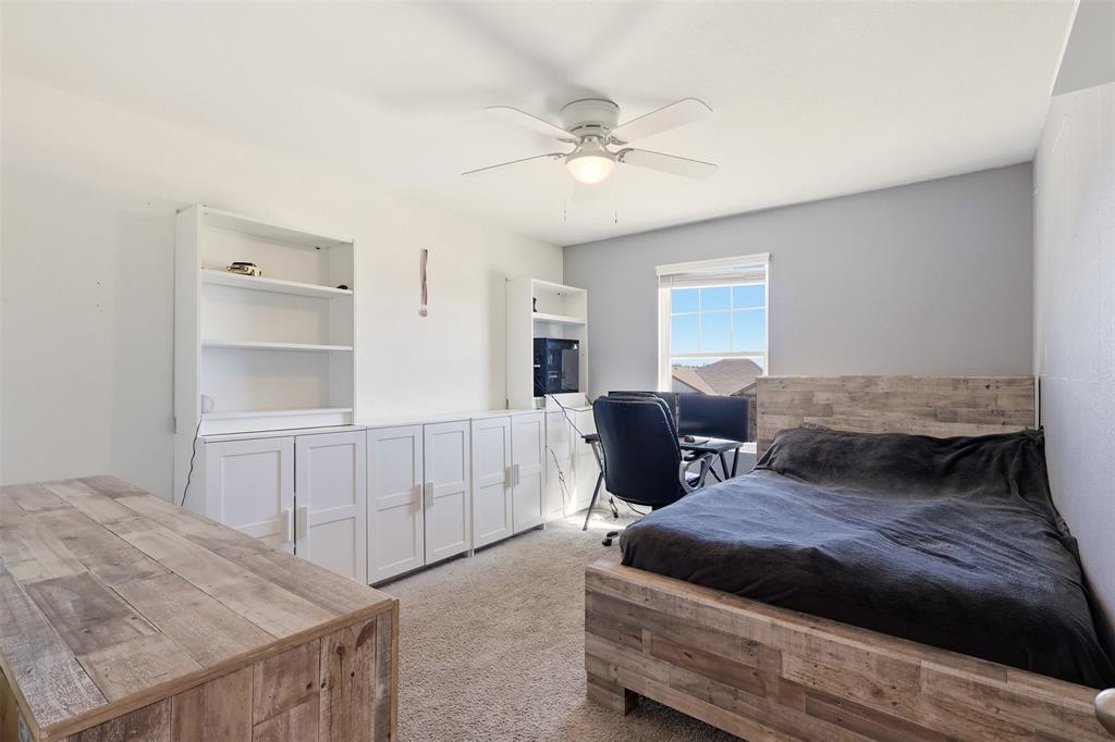 791 Devonshire Drive Lavon, TX 75166 - Photo 22 of 32 a living room with furniture and a dresser