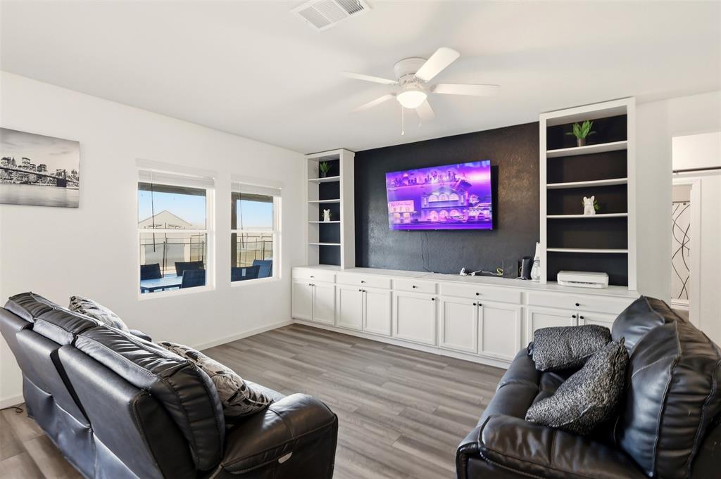 791 Devonshire Drive Lavon, TX 75166 - Photo 6 of 32 a living room with furniture ceiling fan and a window