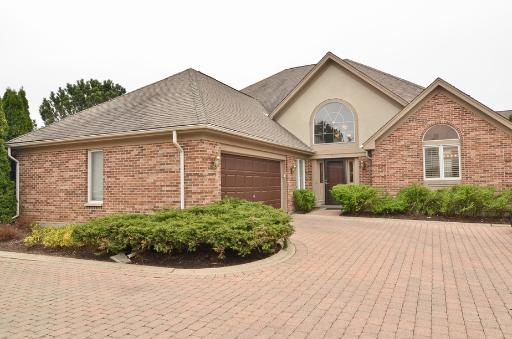 317 Rivershire Court Lincolnshire, IL 60069 - Photo 1 of 1 a front view of a house with a yard and garage