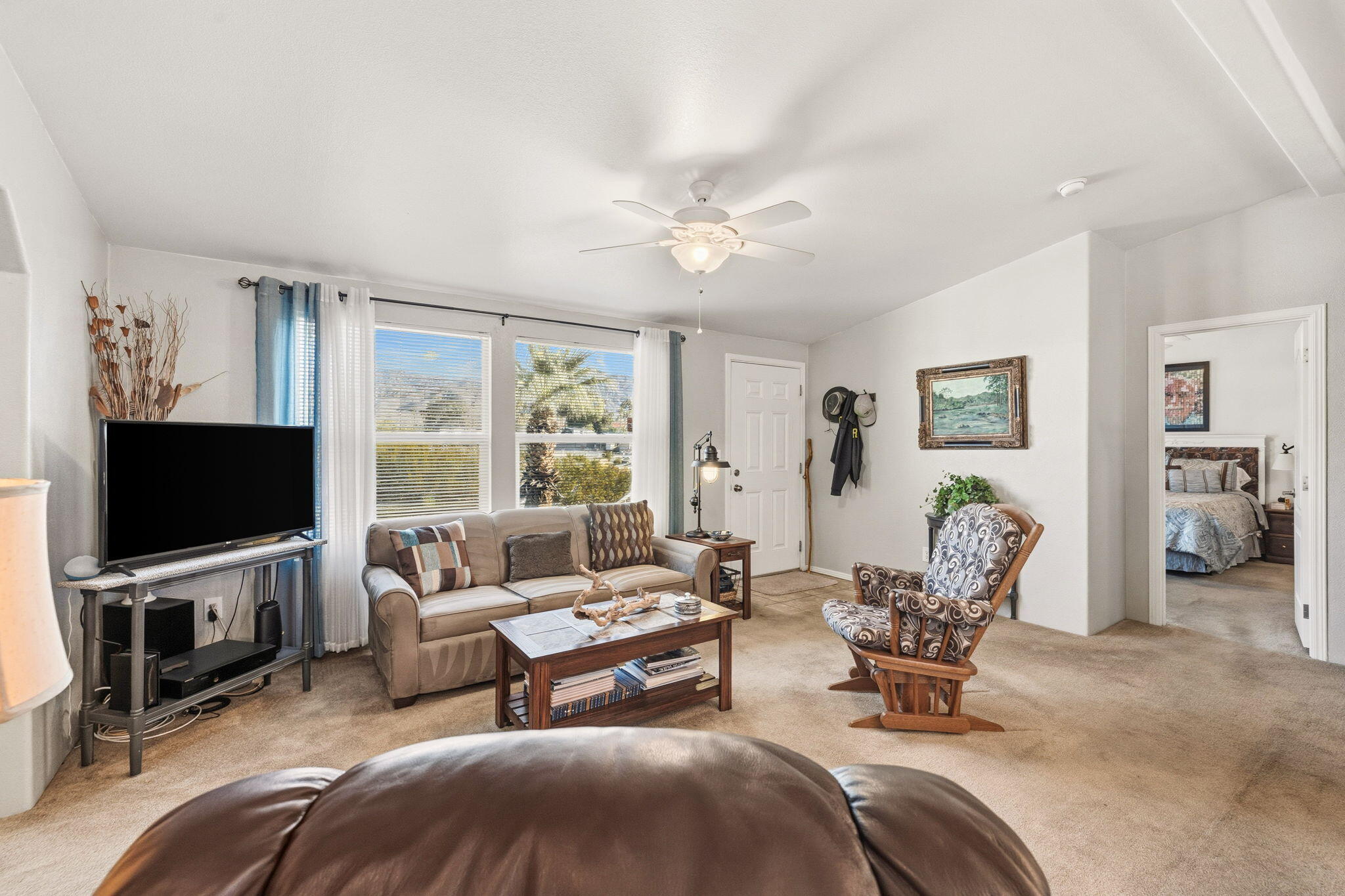 74711 Dillon Road, Unit 312 Desert Hot Springs, CA 92241 - Photo 11 of 49 a living room with furniture and a flat screen tv