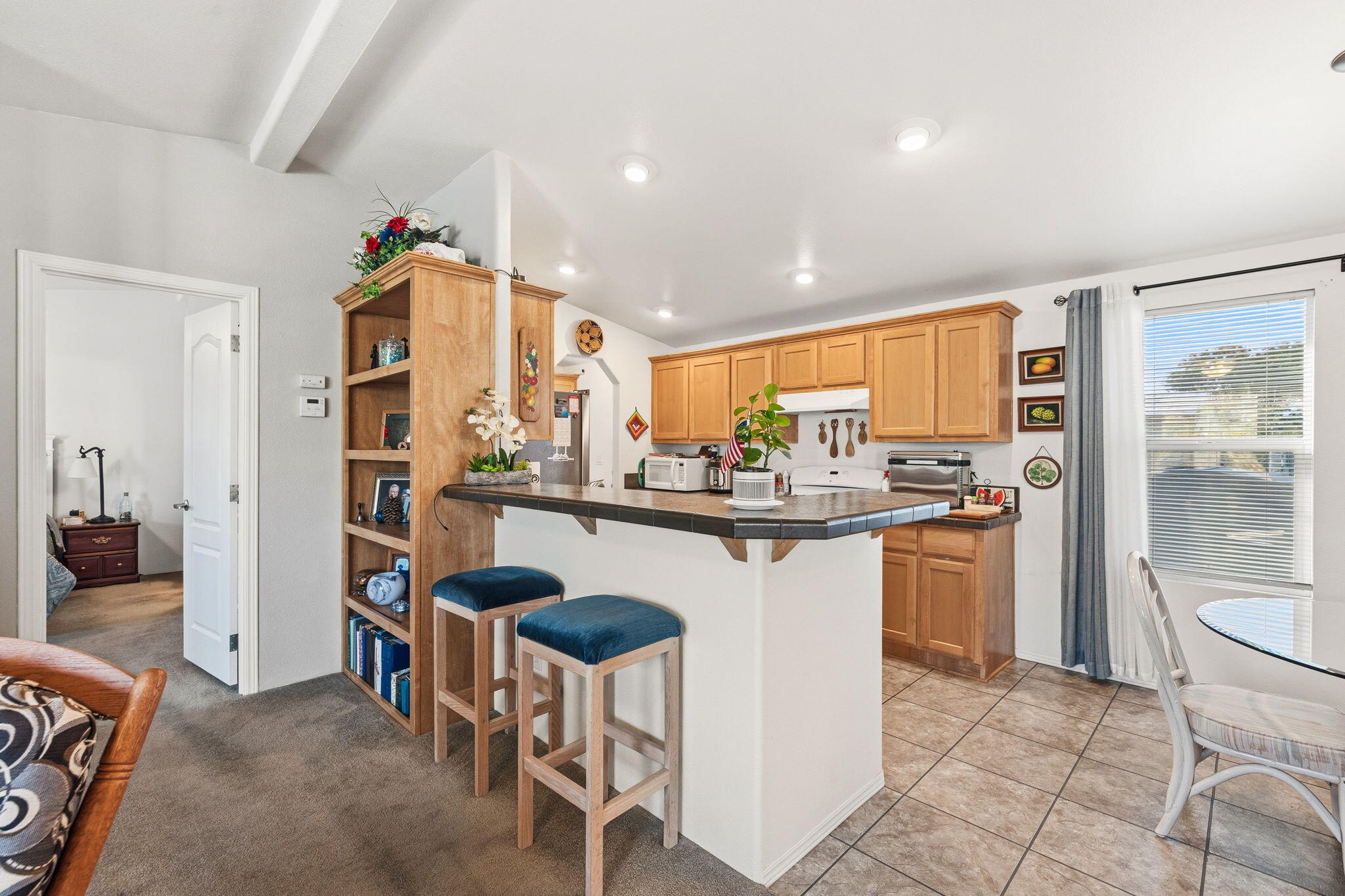 74711 Dillon Road, Unit 312 Desert Hot Springs, CA 92241 - Photo 18 of 49 a kitchen with a sink and chairs