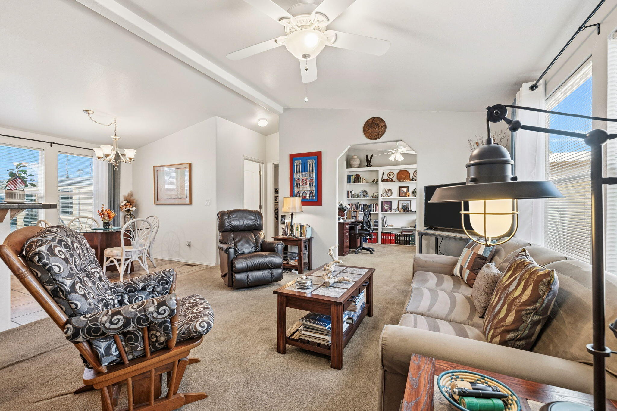 74711 Dillon Road, Unit 312 Desert Hot Springs, CA 92241 - Photo 19 of 49 a living room with furniture a chandelier and a chandelier