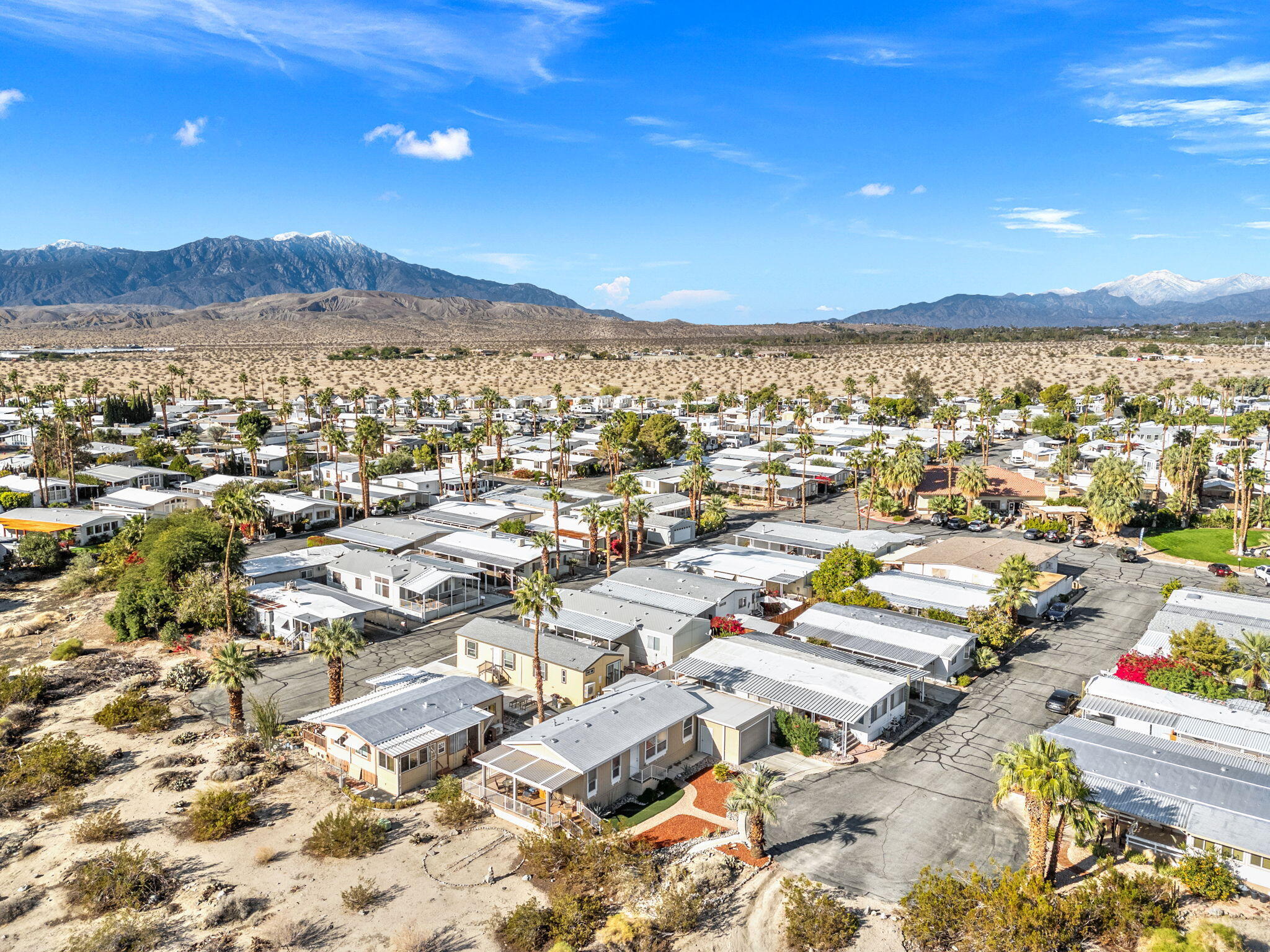74711 Dillon Road, Unit 312 Desert Hot Springs, CA 92241 - Photo 2 of 49 an aerial view of residential houses with outdoor space