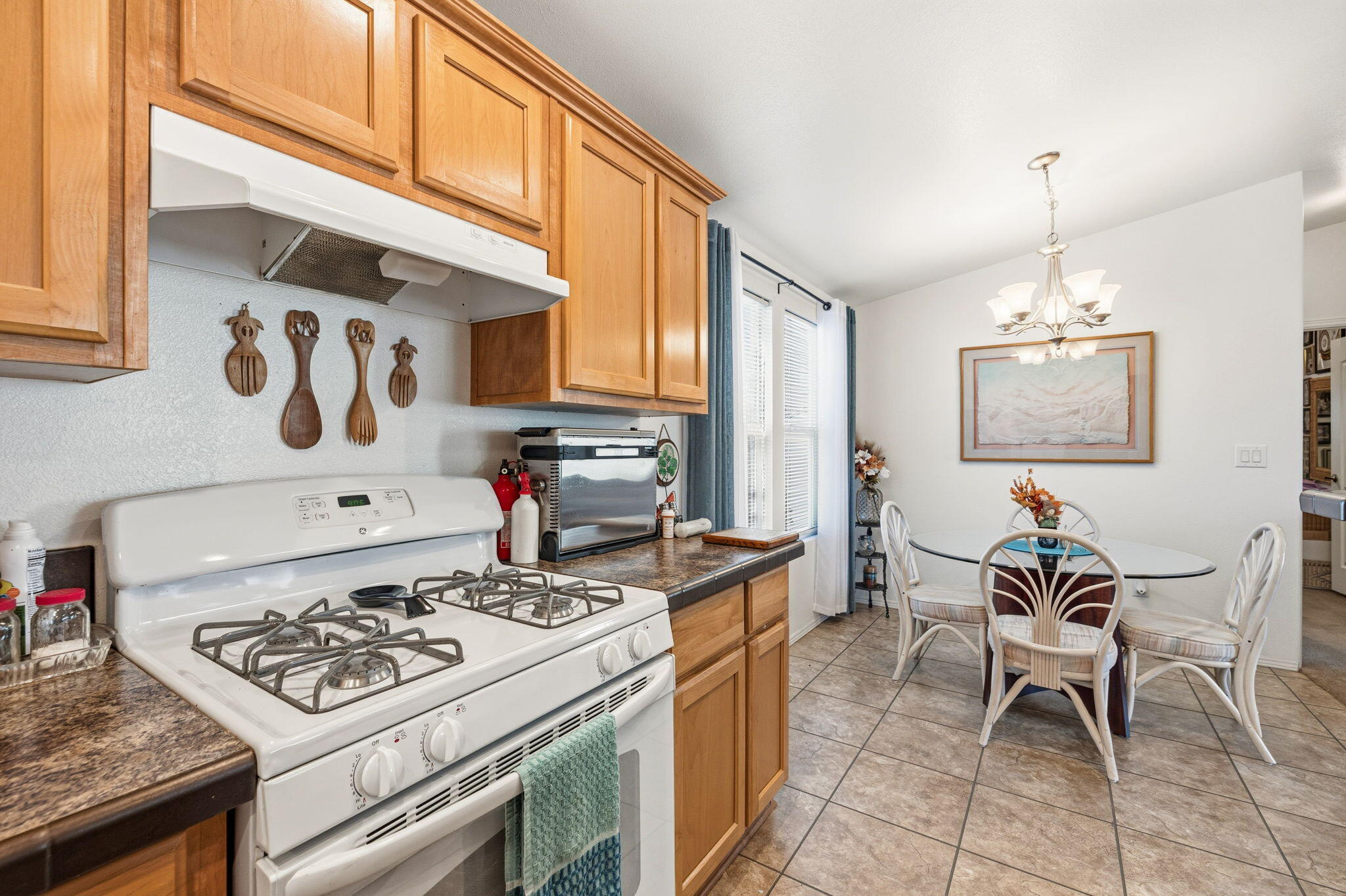 74711 Dillon Road, Unit 312 Desert Hot Springs, CA 92241 - Photo 22 of 49 a kitchen with a stove and a refrigerator