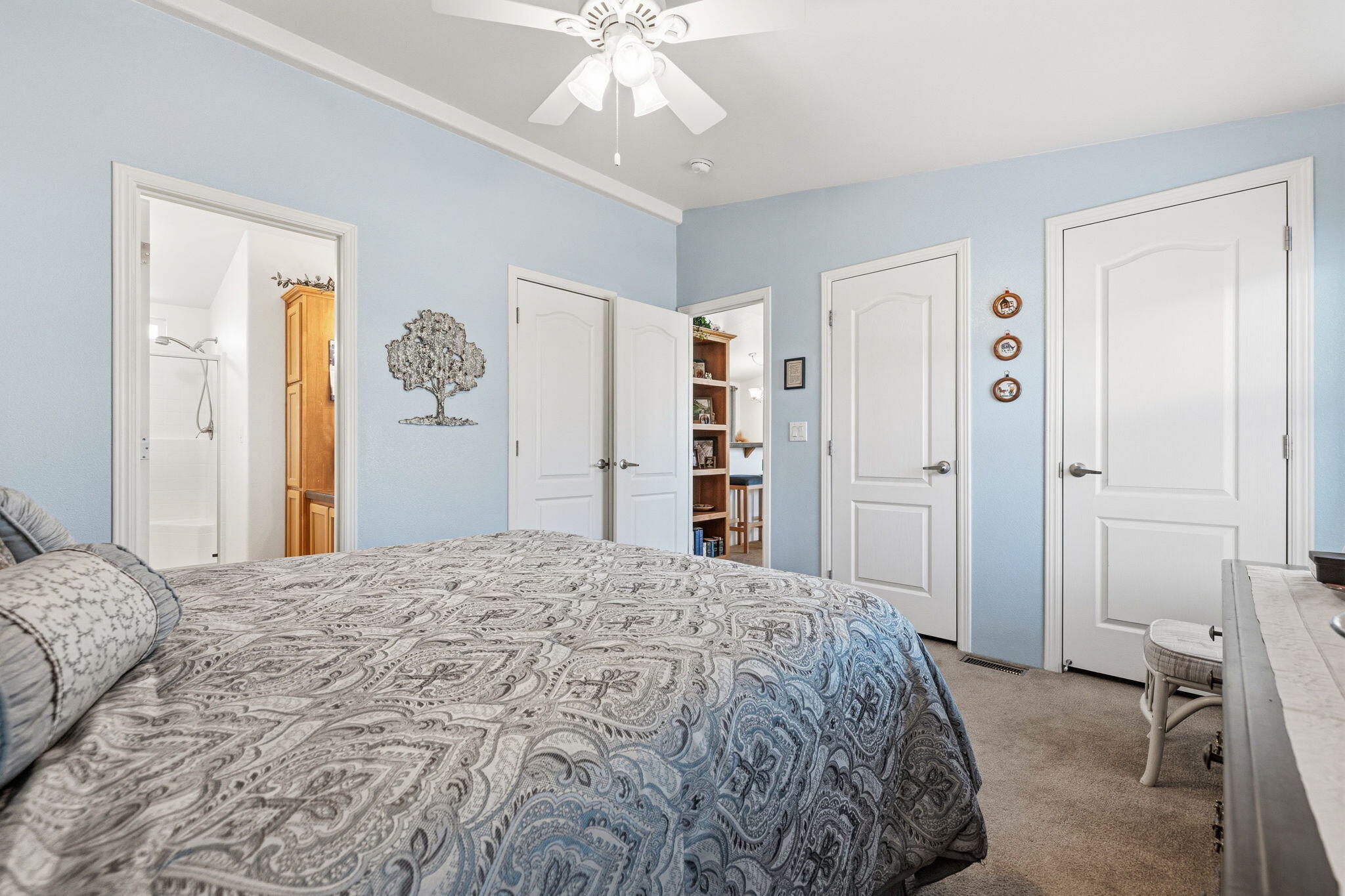 74711 Dillon Road, Unit 312 Desert Hot Springs, CA 92241 - Photo 27 of 49 a bedroom with a large bed and a chandelier