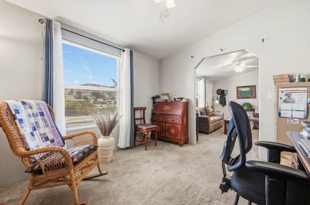 a bedroom with furniture and a window