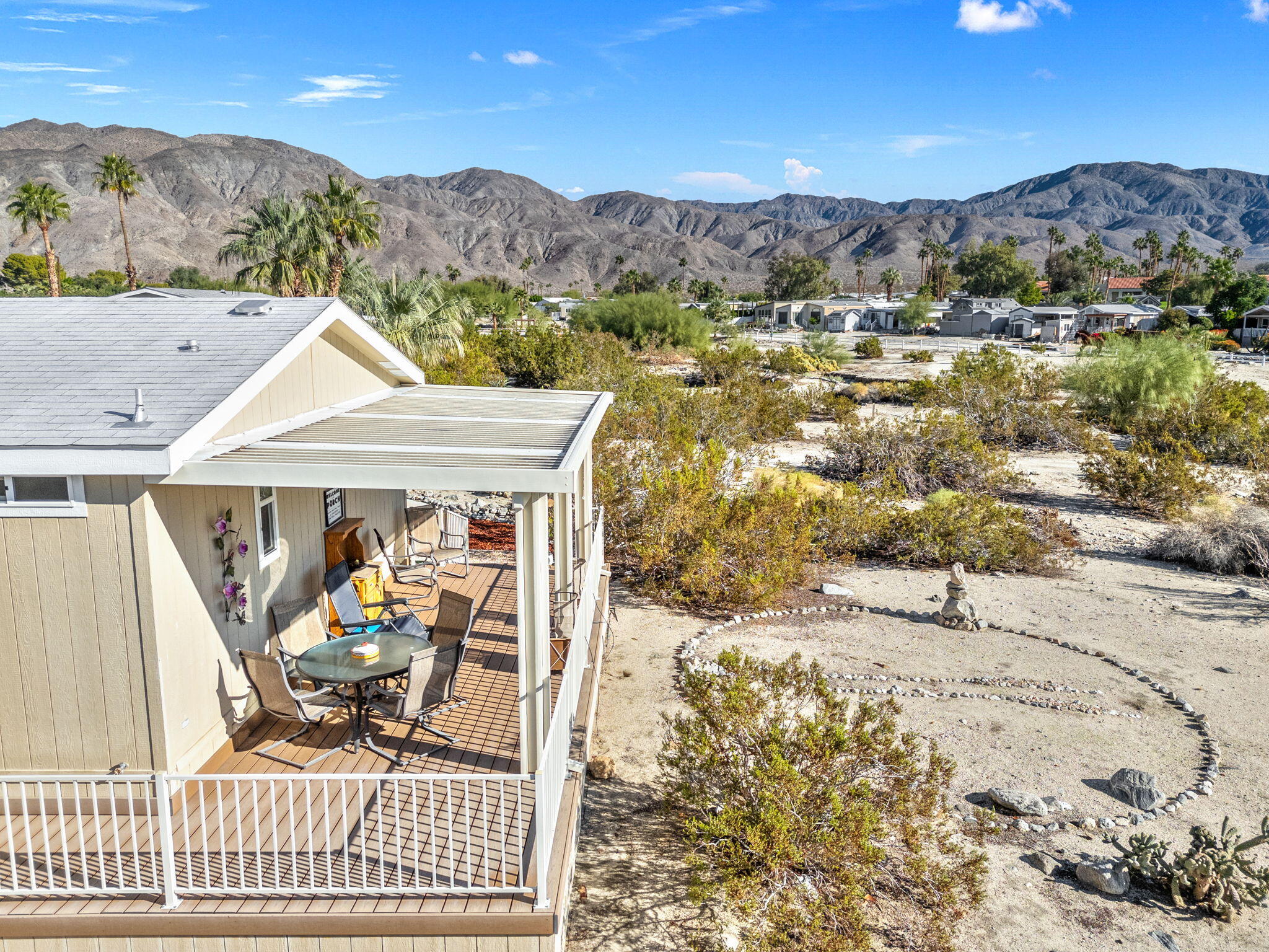 74711 Dillon Road, Unit 312 Desert Hot Springs, CA 92241 - Photo 3 of 49 a view of a terrace with a mountain