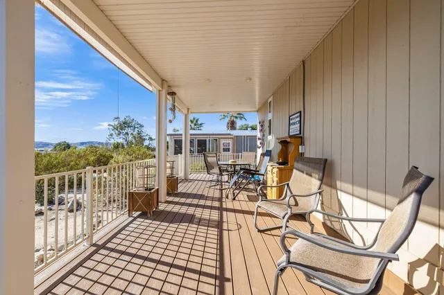 a view of a patio with a table and chairs