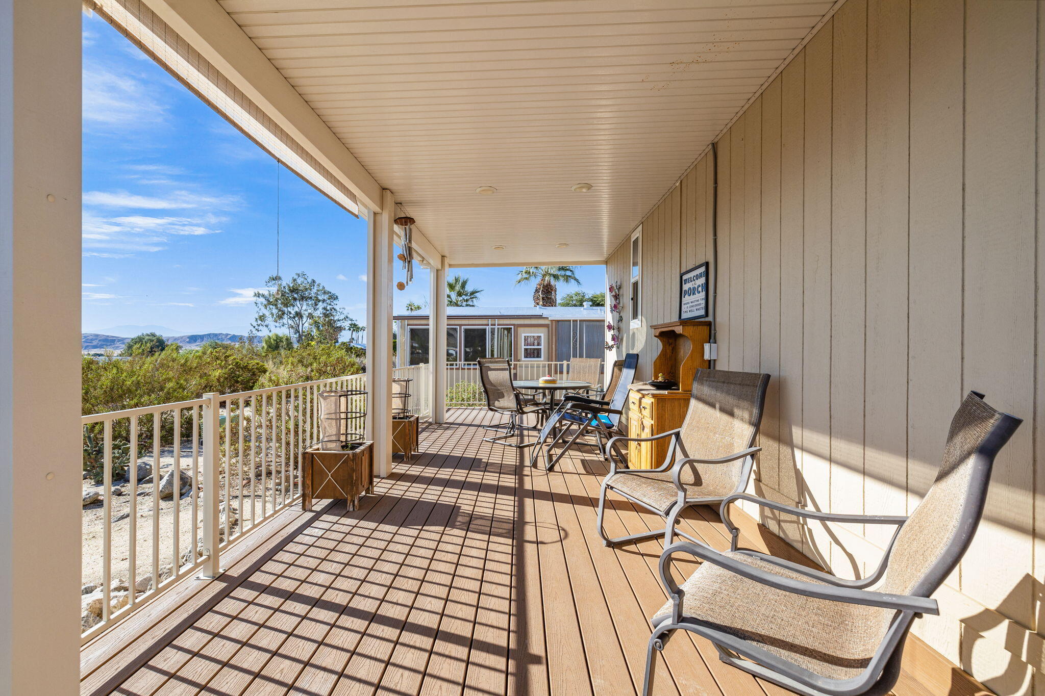 74711 Dillon Road, Unit 312 Desert Hot Springs, CA 92241 - Photo 4 of 49 a view of a patio with a table and chairs