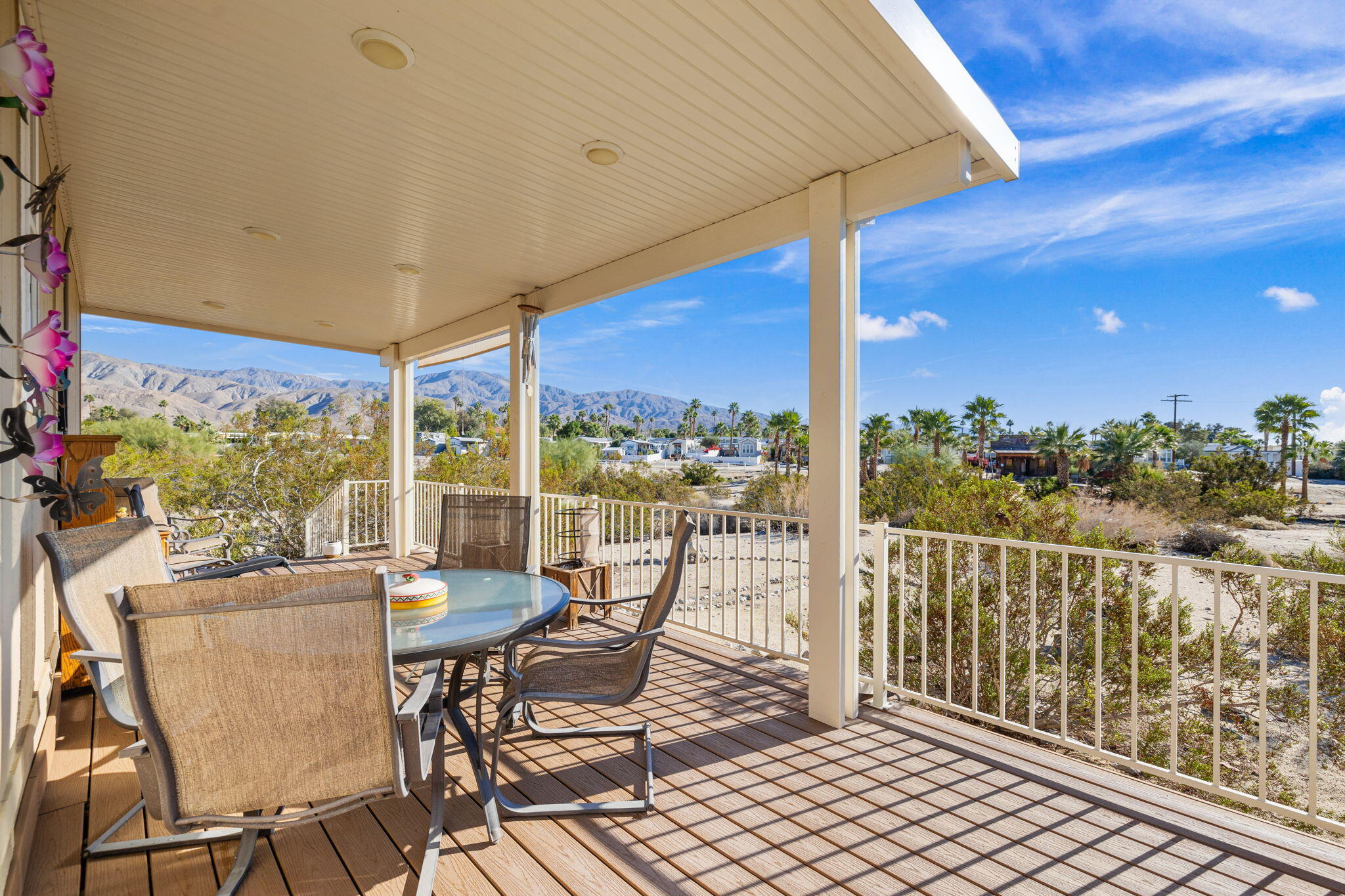 74711 Dillon Road, Unit 312 Desert Hot Springs, CA 92241 - Photo 7 of 49 a view of a chairs and table in the balcony