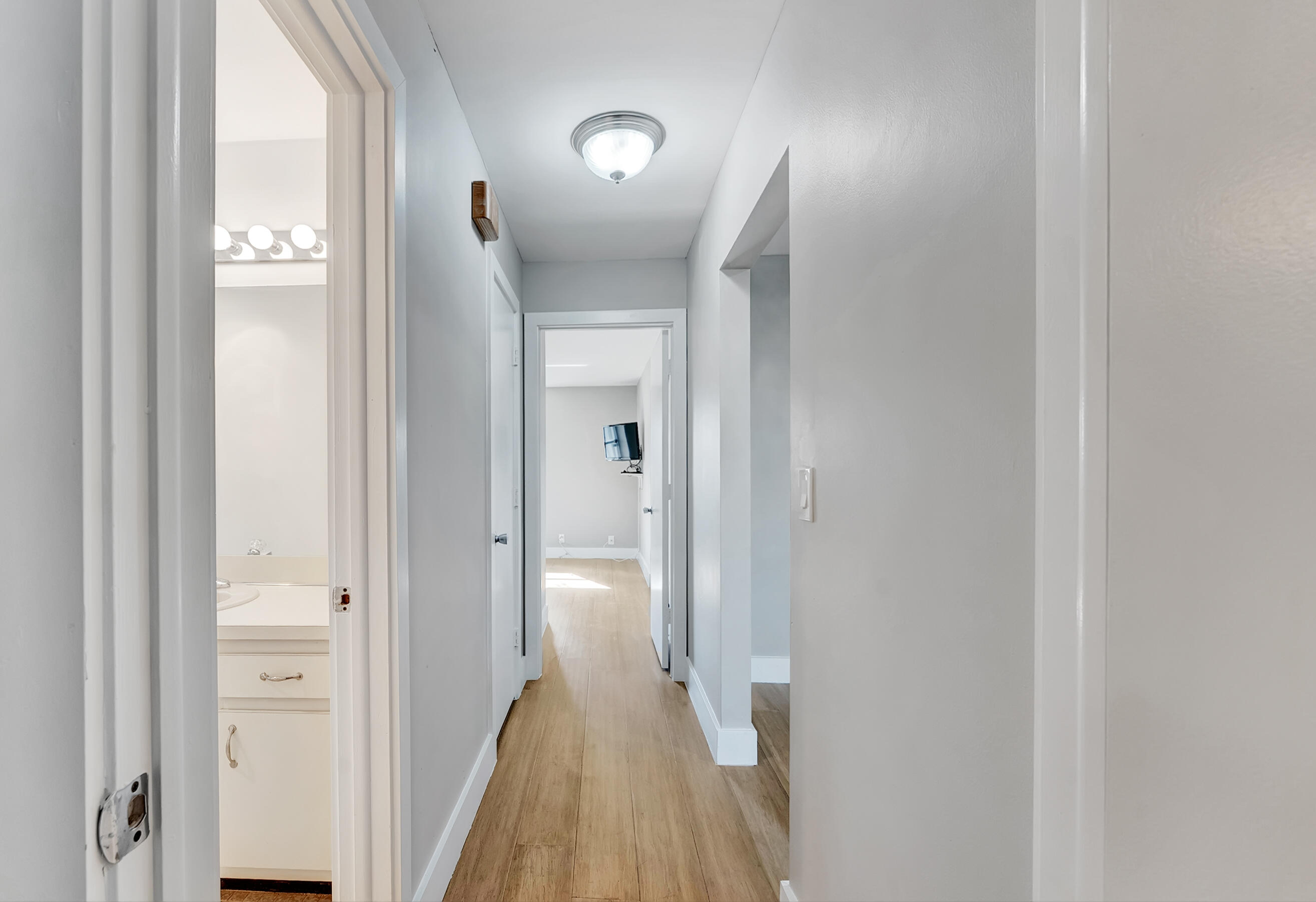 14263 El Clavel Way Delray Beach, FL 33484 - Photo 22 of 39 a view of a bathroom from a hallway