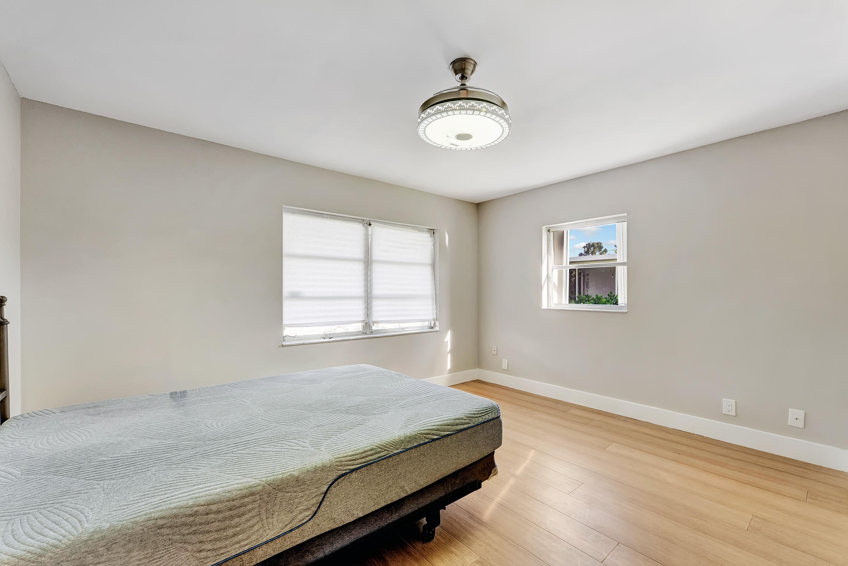 14263 El Clavel Way Delray Beach, FL 33484 - Photo 23 of 39 a bedroom with a bed and a window