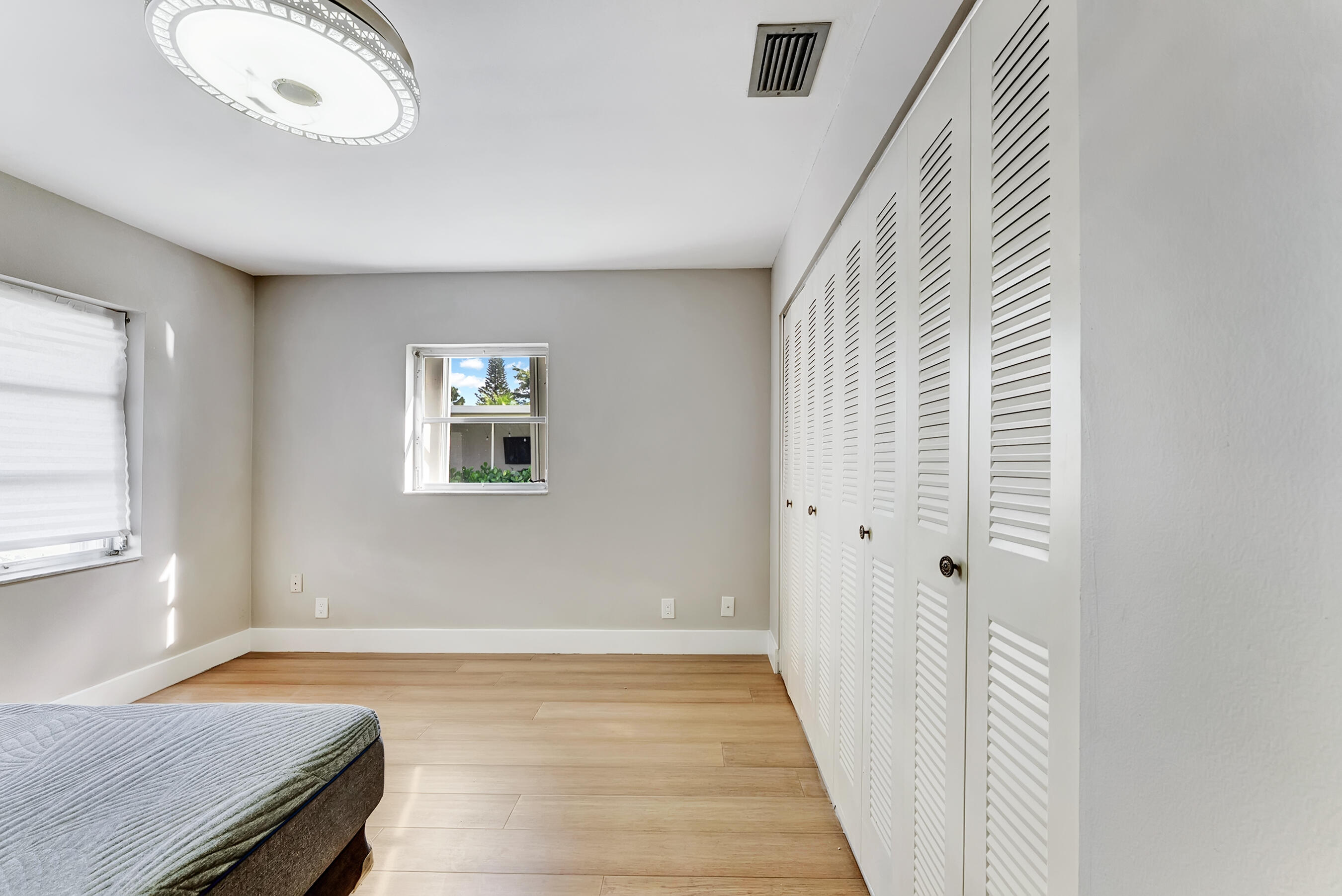 14263 El Clavel Way Delray Beach, FL 33484 - Photo 24 of 39 wooden floor in a hall with an entryway