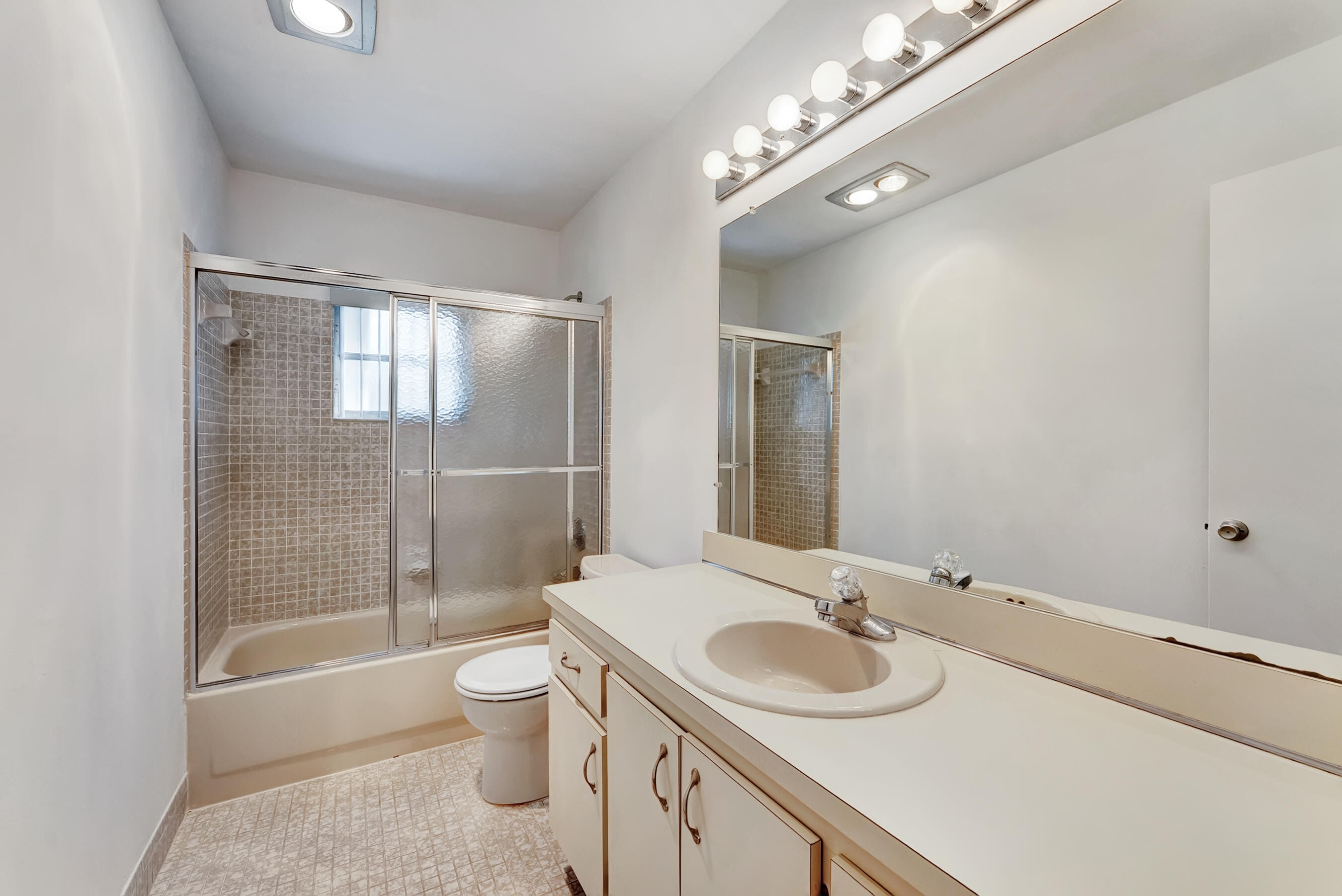 14263 El Clavel Way Delray Beach, FL 33484 - Photo 25 of 39 a bathroom with a sink a toilet and shower