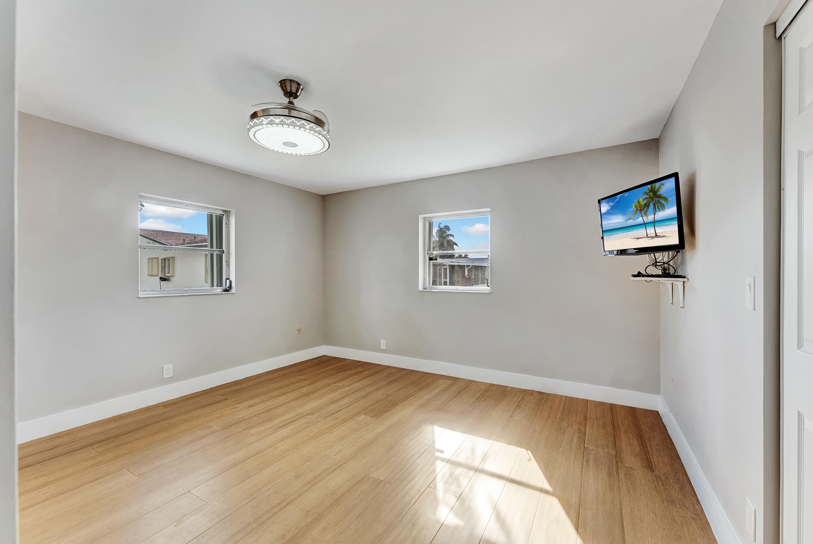 14263 El Clavel Way Delray Beach, FL 33484 - Photo 26 of 39 a view of empty room with wooden floor
