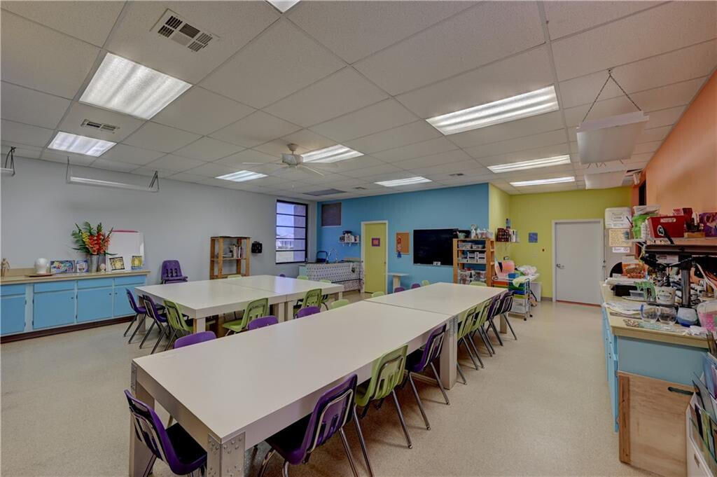 14263 El Clavel Way Delray Beach, FL 33484 - Photo 36 of 39 a large dining space with furniture a rug and a projector