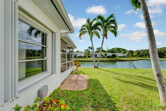 a view of a lake with a house in the background