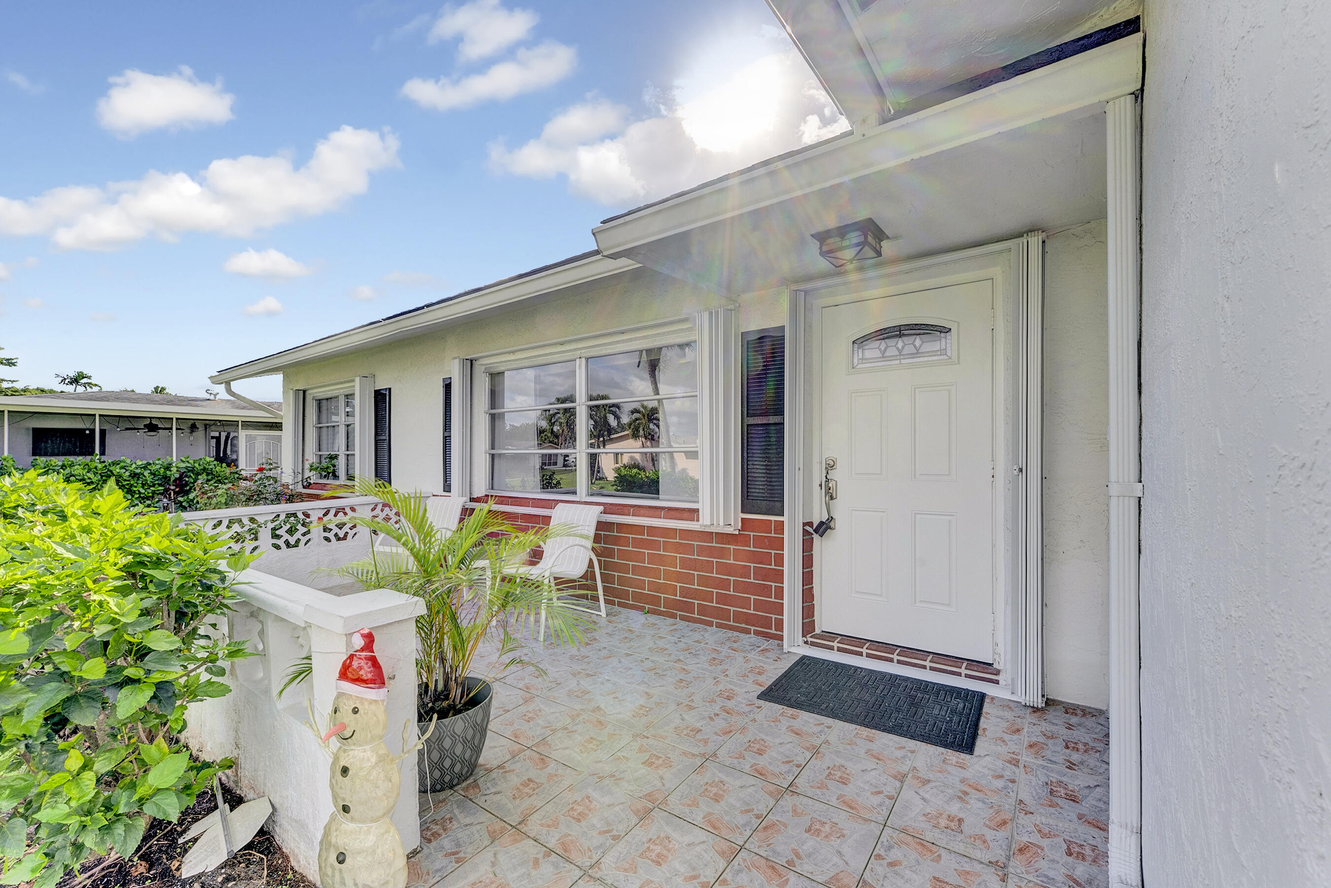 14263 El Clavel Way Delray Beach, FL 33484 - Photo 5 of 39 a front view of house with outdoor seating