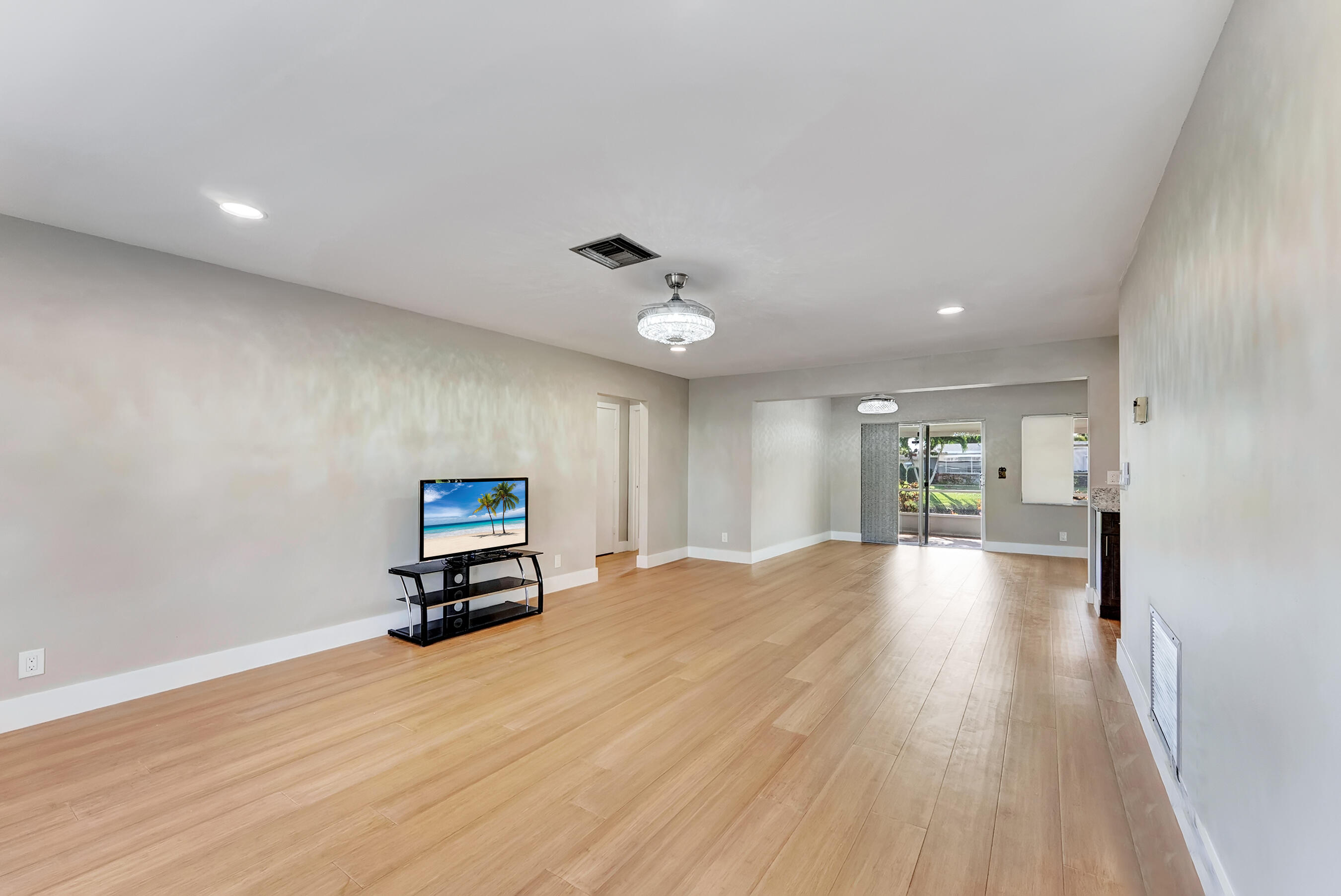 14263 El Clavel Way Delray Beach, FL 33484 - Photo 10 of 39 a view of empty room with wooden floor