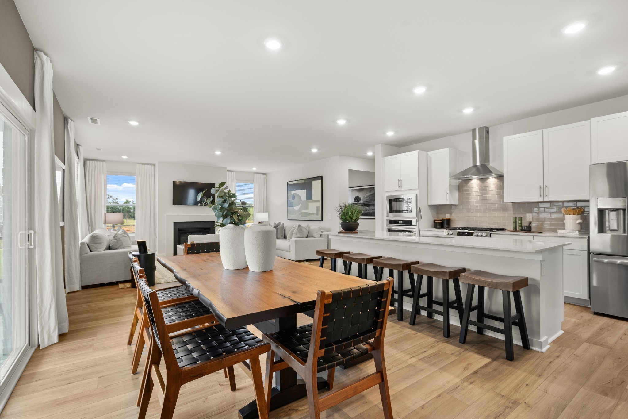 3440 Shigo Street Murfreesboro, TN 37130 - Photo 22 of 69 a kitchen with stainless steel appliances kitchen island granite countertop a dining table chairs and view kitchen