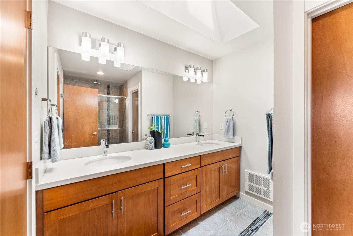 12418 2nd Place Southwest Burien, WA 98146 - Photo 15 of 39 a bathroom with a double vanity sink and a mirror