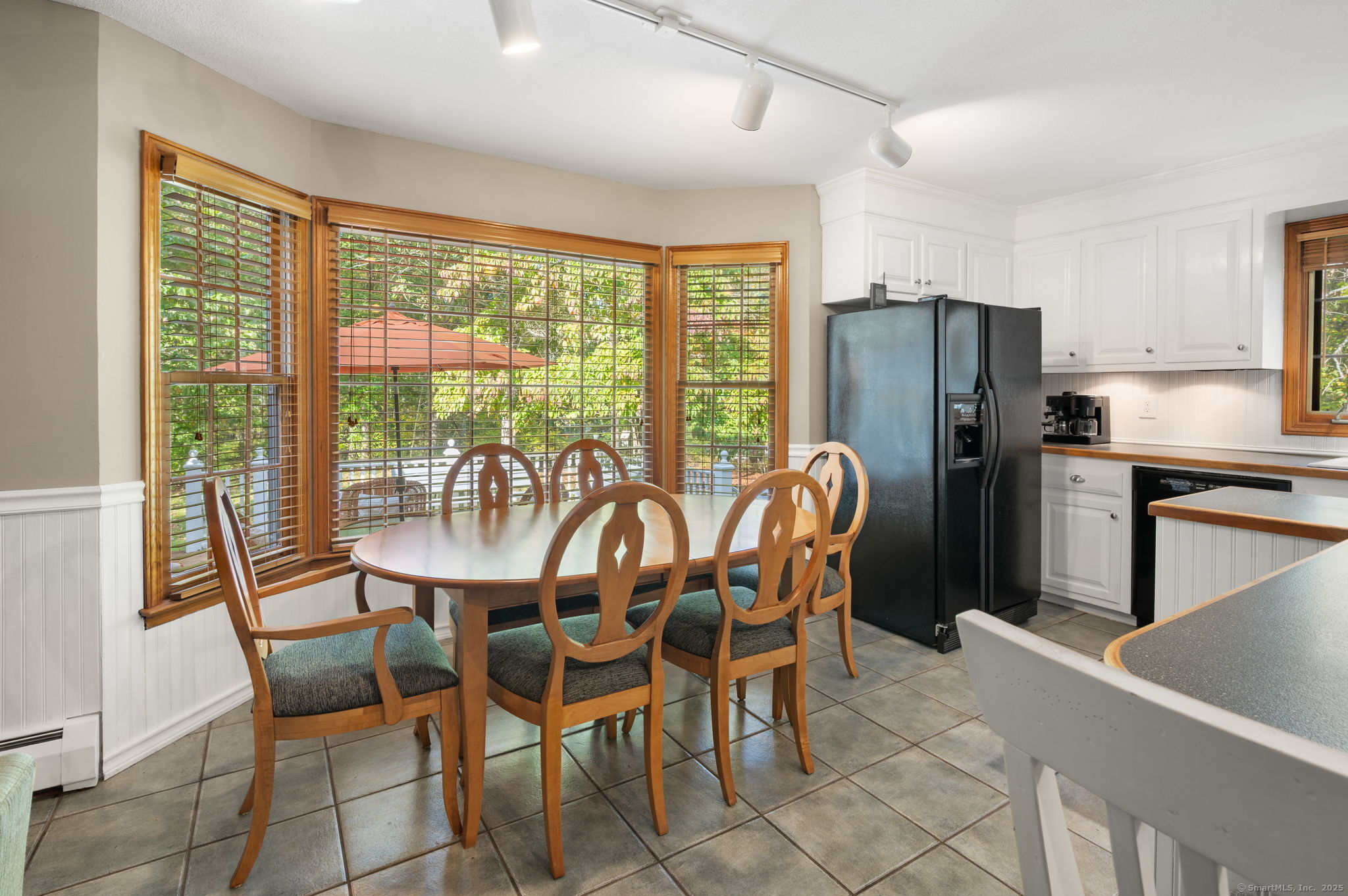 383 Lathrop Road Plainfield, CT 06374 - Photo 12 of 40 a dining room with furniture a chandelier and a bath room
