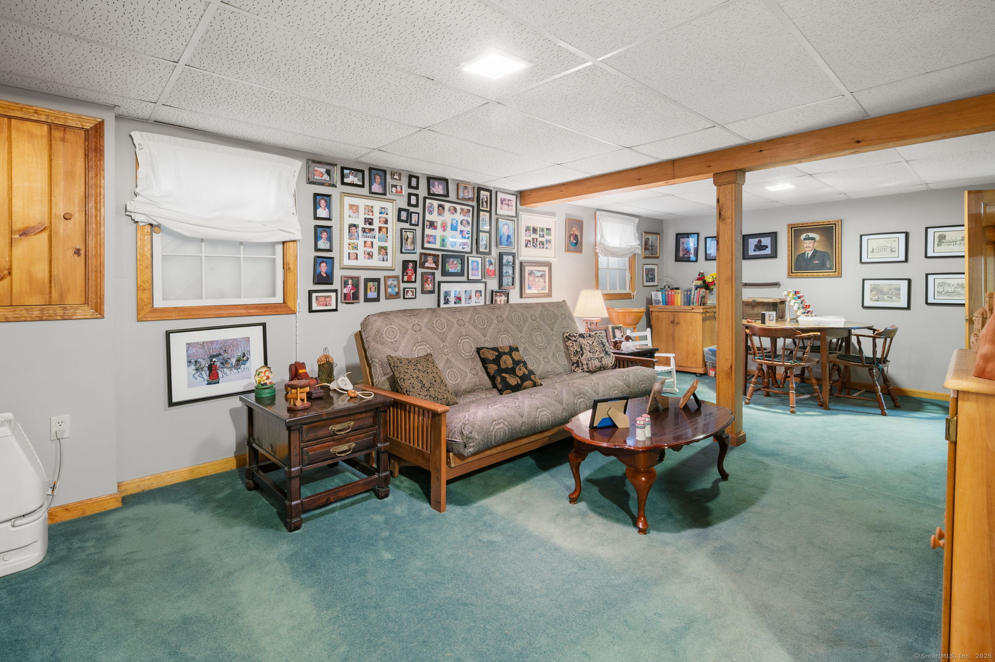 383 Lathrop Road Plainfield, CT 06374 - Photo 16 of 40 a living room with furniture and a large window