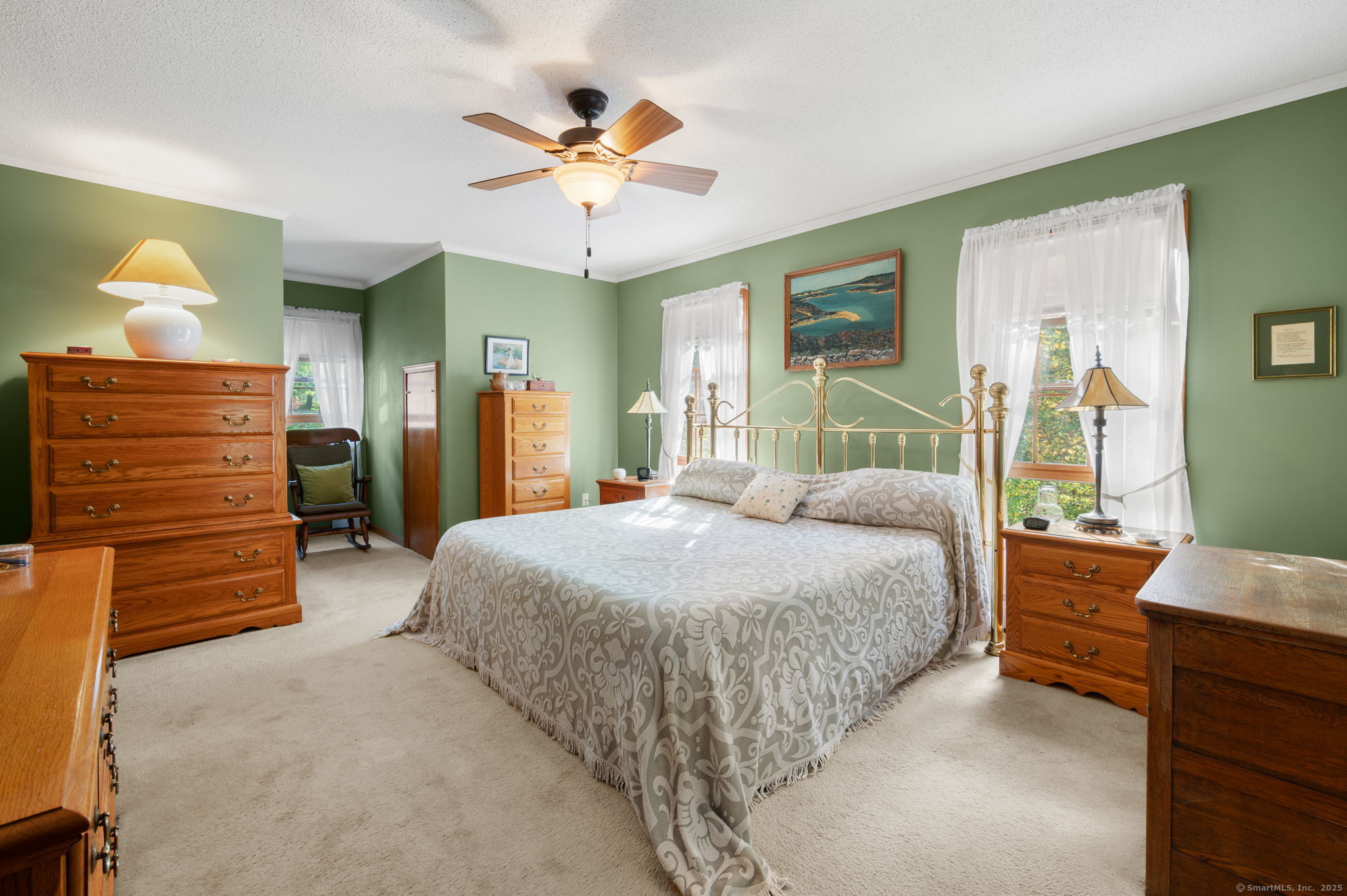 383 Lathrop Road Plainfield, CT 06374 - Photo 19 of 40 a bedroom with a bed and a chandelier