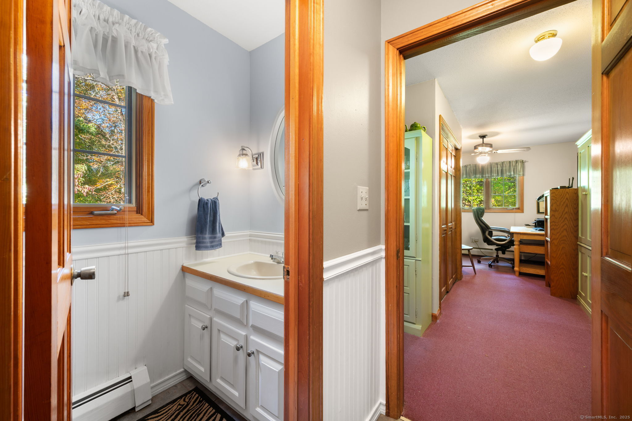 383 Lathrop Road Plainfield, CT 06374 - Photo 19 of 40 a view of a bathroom with a sink and a mirror