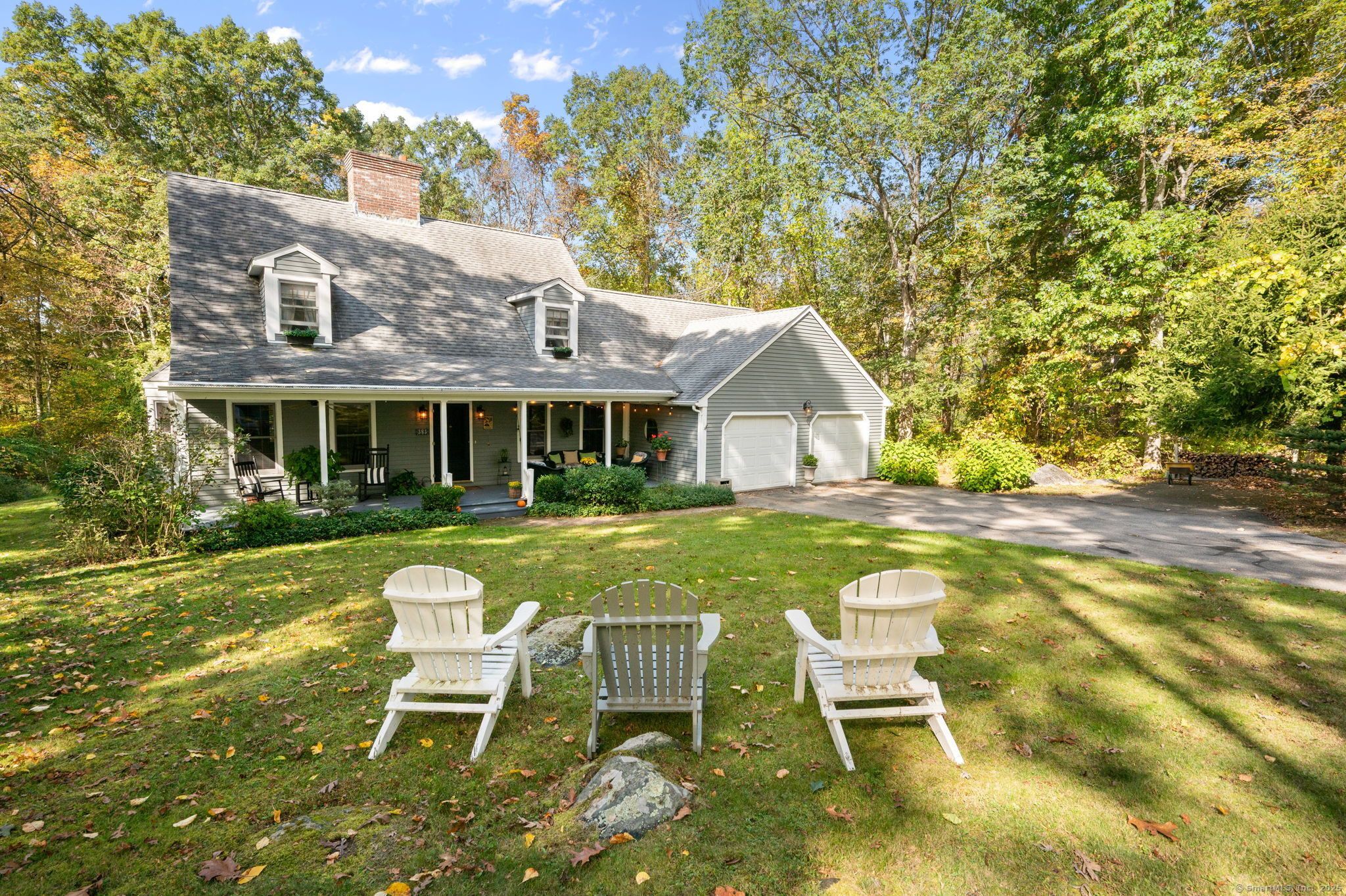 383 Lathrop Road Plainfield, CT 06374 - Photo 2 of 40 a view of a house with a yard chairs and table in patio