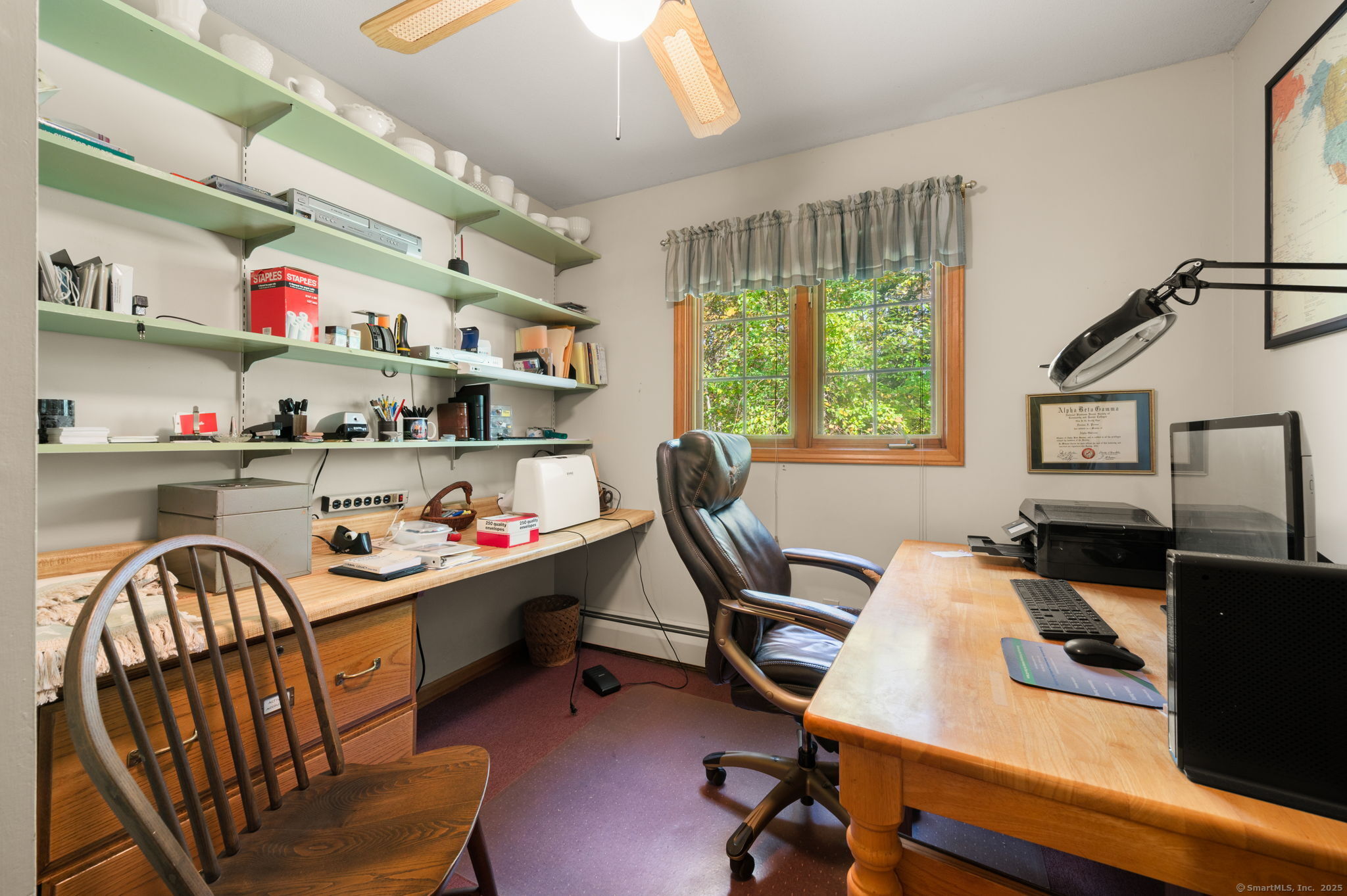 383 Lathrop Road Plainfield, CT 06374 - Photo 21 of 40 a view of a workspace with furniture and a window