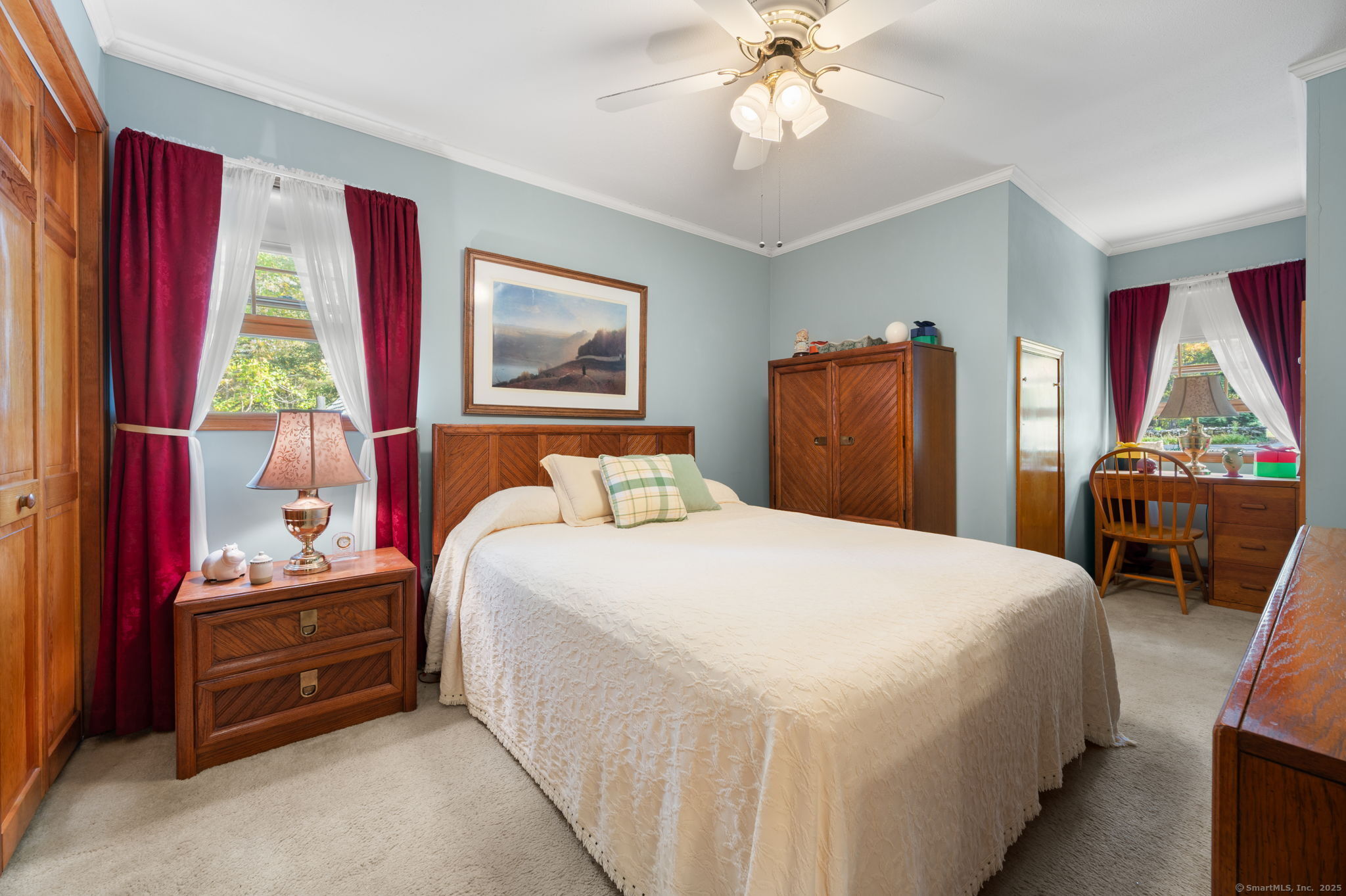 383 Lathrop Road Plainfield, CT 06374 - Photo 29 of 40 a bedroom with a bed and a chandelier