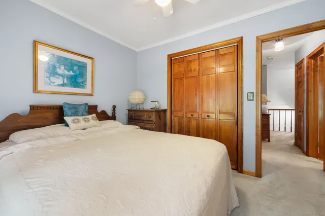 a bathroom with a sink a toilet a mirror and vanity