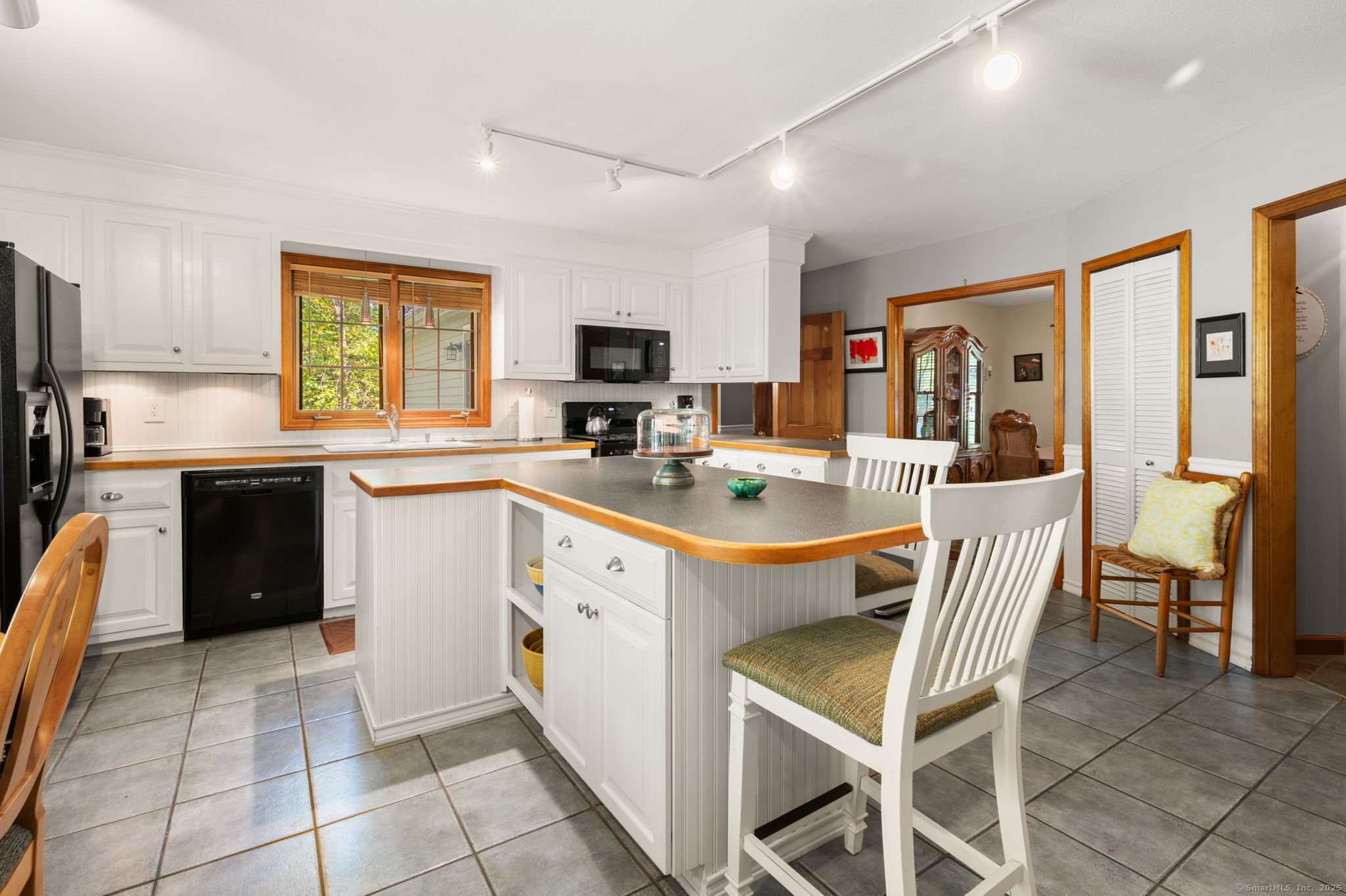 383 Lathrop Road Plainfield, CT 06374 - Photo 35 of 40 a kitchen with a sink a counter top space appliances and cabinets