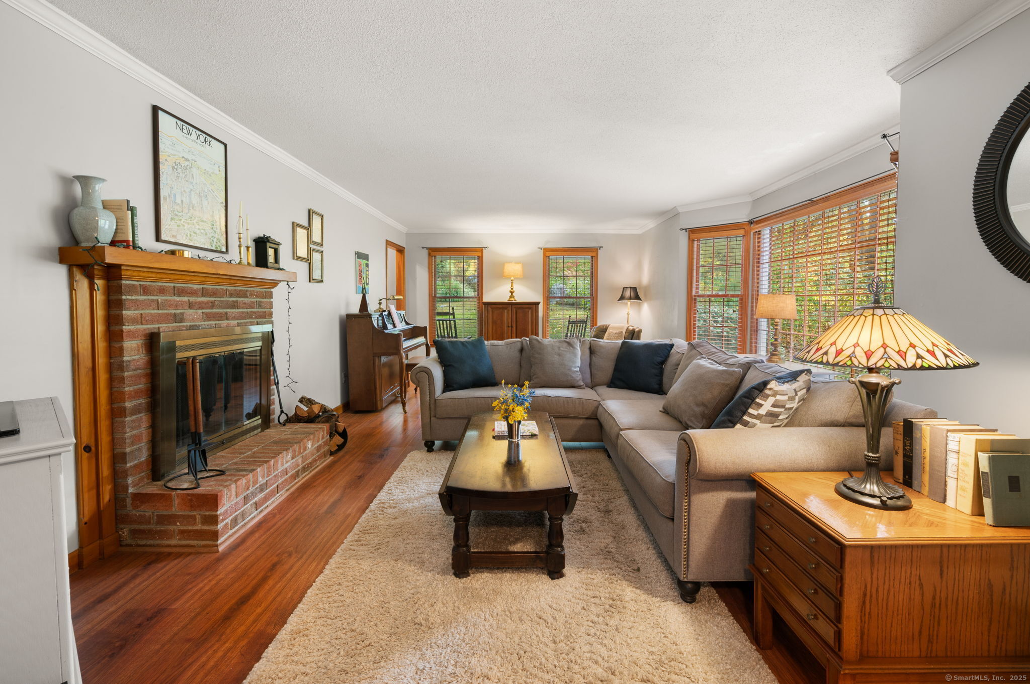 383 Lathrop Road Plainfield, CT 06374 - Photo 6 of 40 a living room with furniture and a fireplace